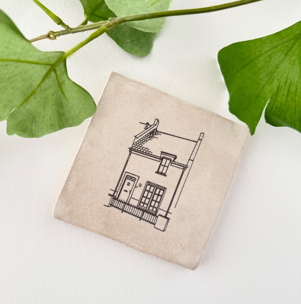 Huis op tegeltje als lijntekening